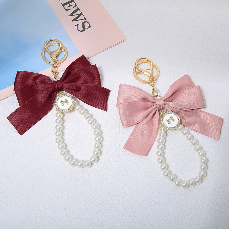 Cute Pearl Silhouette Bow Tie Keychain Wristlet Bracelets Keyring for Women Purse Bag Charm Accessories with Silly Doll Pattern