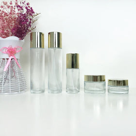 Cosmetic Empty 40ml 120ml 30g 50g clear Skincare Set Glass Packaging for Cream Lotion with Gold Lid
