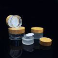 Wholesale 5g 10g 15g 20g 30ml 50g 60g 100g clear Frosted Glass Jar with Bamboo Lid for Cosmetic Skincare Scrub Cream Custom