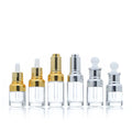Customized 20ml 30ml 50ml Clear Frosted Glass Essential Oil Serum Dropper Bottle with Gold Silver Cap for Skin Care MOQ 100pcs