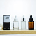 High Quality 30ml Custom Flat Shoulder Frosted Amber Clear Serum Bottle Essential Oil Glass Dropper Bottle With Gift Box