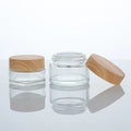 Wholesale Cosmetic Luxury 30g 50g clear Glass Cream Jar with Wood Grain Plastic Lid Face Cream Container 1 oz Eye Cream Pot