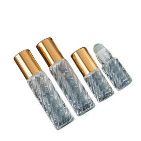 Wholesale 5ml 10ml Swril Twisting Spiraling clear Roll on Glass Bottle with Glass Roller and Shiny Gold Caps