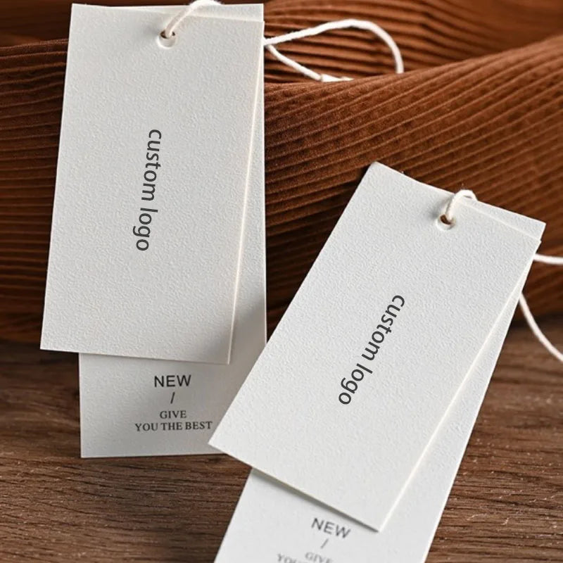 Luxury Custom Recyclable White Double Swing Hang Tag PVC Printed Textured Paper for Clothing Bags Shoes Hot Stamping Labels Toys