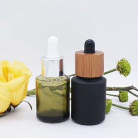 1ounce Slant Shoulder Olive Green Frosted Black 30ml Glass Oil Serum Bottle with Dark Wooden Texture Pump Closures