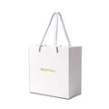 Wholesale High-End Recyclable Paper Gift Bags Custom Logo Black White Craft Design Luxury Handbag Ribbon Photo Frame Candle
