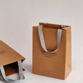 Customized Eco-Friendly Brown Kraft Paper Bag with Handle Biodegradable Gift Packing for Clothing and Shoes Coated Paper Type
