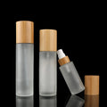 Luxury Frosted 30ml 50ml 80ml 100ml Glass Bottle with Bamboo Lid for Face Cream for Cosmetics Packaging