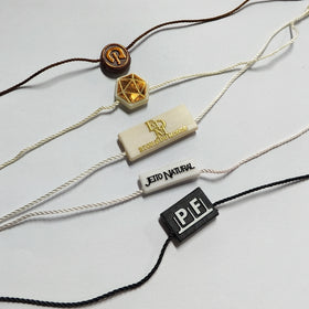 YH-ST06 Round Custom 3D Embossed Name Logo Plastic Hang Fasteners Seal Tag Nylon Wax String for Shoe and Clothing