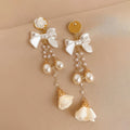 Fashion Pearl Pearl Bow Crystal Camellia Pendant Tassel S925 Silver Needle Long Pearl Tassel Earrings