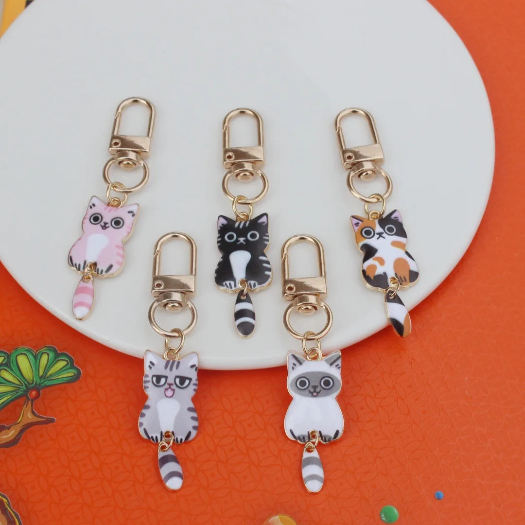 Cute Lovely Enamel Pet Lucky Cat Keychain Kawaii Cartoon Metal Wagging Tail Cat Kitten Keyring for Earphone Case Phone Bag Charm