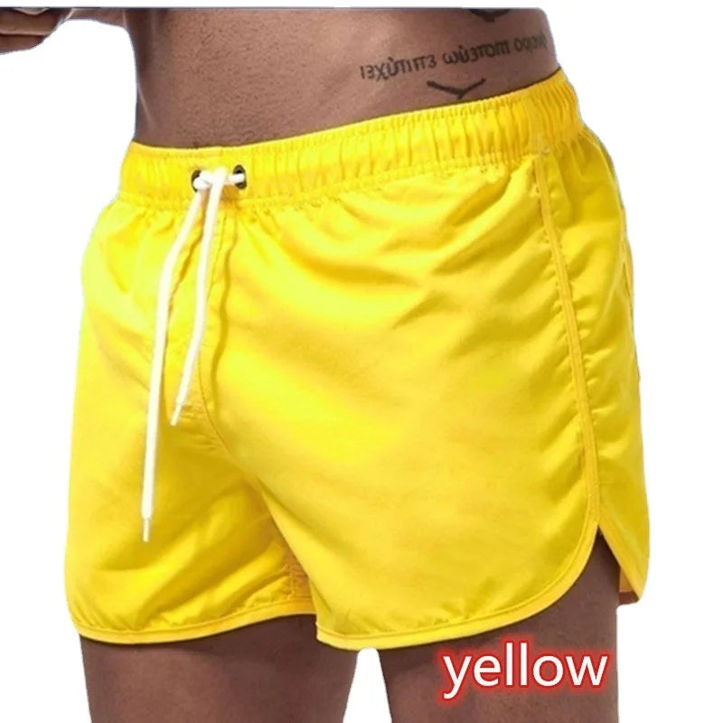 Wholesale Men's Casual Gym Sports Pants Solid Color Beach Shorts with Elastic Mid Waist Multicolor Three-Point Youth Shorts
