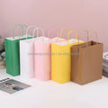 Wholesale Sustainable Ribbon Handle Gift Carrier Packaging Custom Logo Print Design Luxury Kraft Paper Shopping Bag