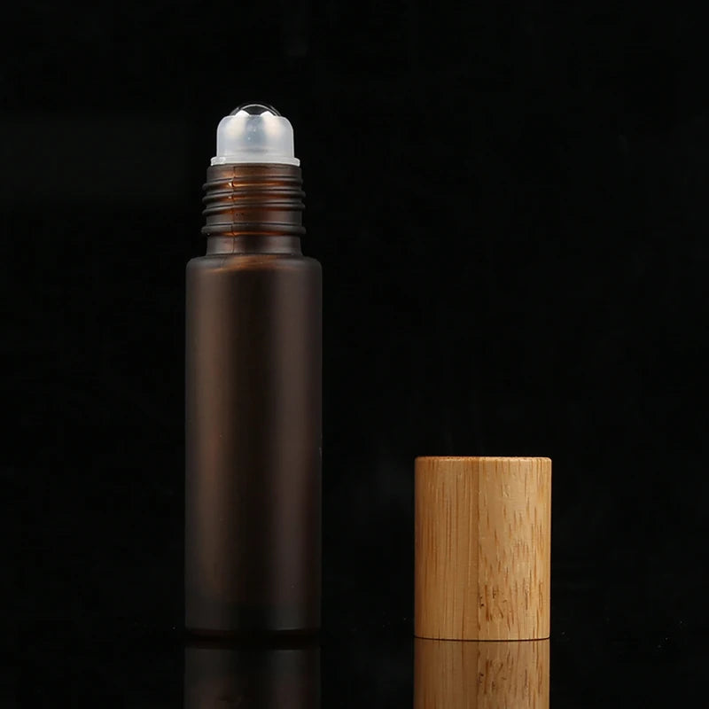 Wholesale Hot Sale Good Quality Amber Essential Oils Roll-on Container 10ml Clear Glass Roller Bottle with Bamboo Cap