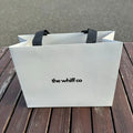 Custom White Clothing Gift Packaging Paper Bag With Handle Luxury Recycled Shopping Bag for Apparel and Branding