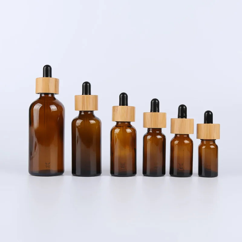 Custom 50ml Multi Specification Skin Care Body Oil Bottle Bamboo Essential Oil Amber Glass Dropper Bottle with Bamboo Cap