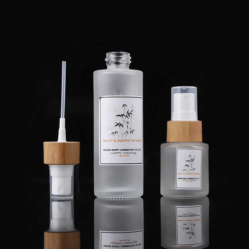 Customized Cosmetic Glass Spray Bottle 1.7 Oz 50 Ml Empty Cosmetic Lotion Bamboo Collar Frosted Glass Pump Bottle