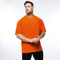 Custom OEM Plain Gym Clothing Mesh Fitness Mens Oversized T Shirt Hip Hop Streetwear Loose Half Sleeve T-shirt Bodybuilding Tees